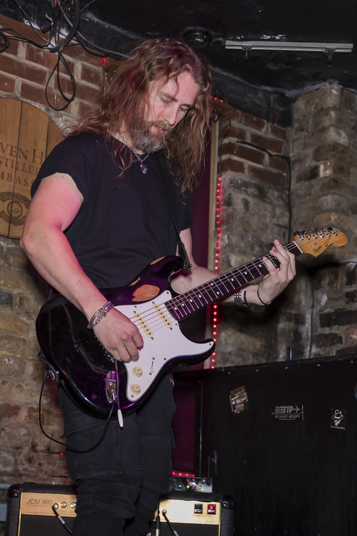 Cash Ulrich playing guitar at a live venue