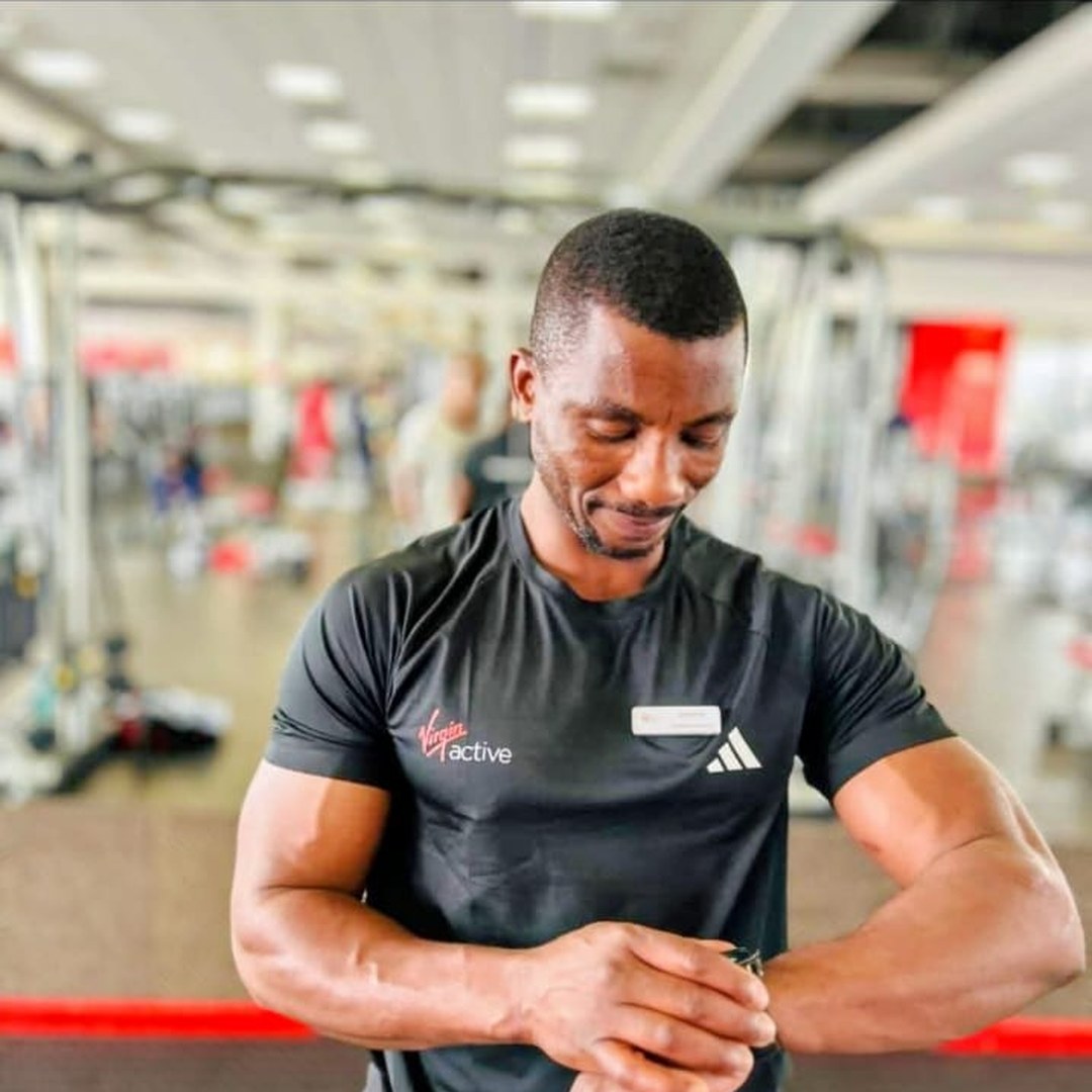 Andrew Ntlebi on the gym floor between sets