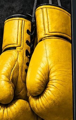 Yellow boxing gloves at Box 2 B Fit Gym